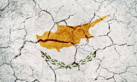 Republic of Cyprus flag on dry earth ground texture backgroundの写真素材