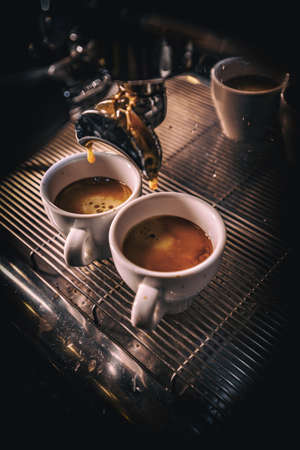 Coffee machine makes two coffeeの写真素材