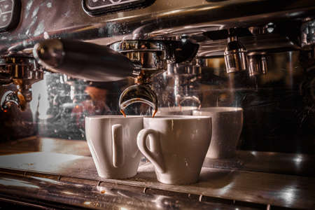 Professional coffee machine making espresso in a cafeの写真素材