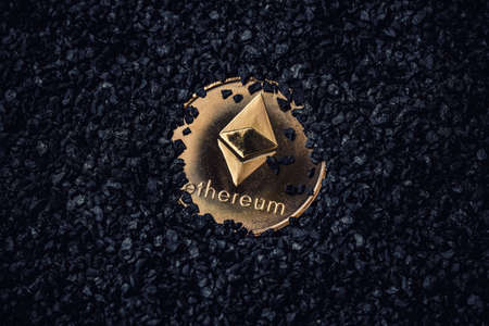 Gold coin with cryptocurrency logo. Ethereum coin on black background