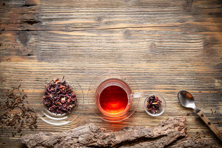 Flat lay view of cup of tea on vintage wooden backgroundの写真素材