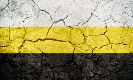 Perak Darul Ridzuan, states of Malaysia, flag on dry earth ground texture backgroundの写真素材