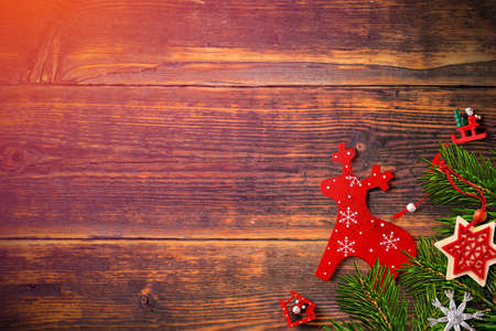 Christmas background with fir branches and decorations wooden tableの写真素材
