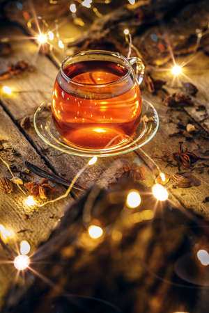 Tea in glass cup with blurred light.