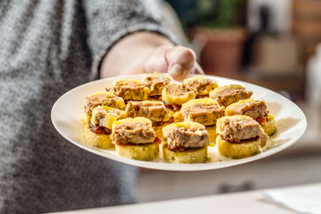 Mini sandwiches with onion chutney and pulled duck meat