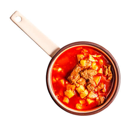 Flat lay of goulash soup on white backgroundの写真素材