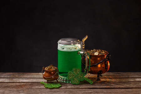 St Patrick's Day concept with green beer and pot of gold, space for your textの写真素材