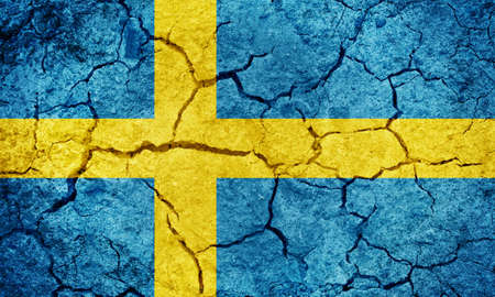 Kingdom of Sweden flag on dry earth ground texture backgroundの写真素材
