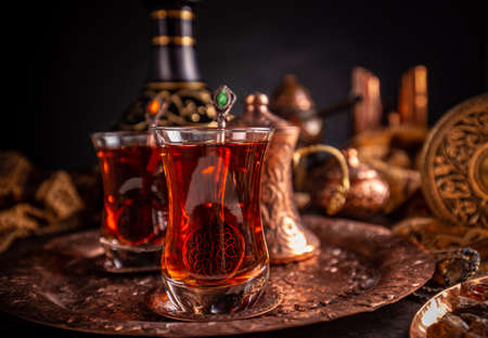 Black Turkish tea in traditional glass on trayの写真素材