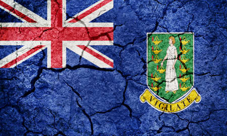 Flag of the British Virgin Islands on dry earth ground texture backgroundの写真素材