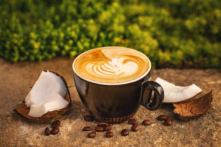 Cup of warm tasty coconut coffeeの写真素材