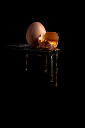 Concept image of a broken brown egg shellの写真素材