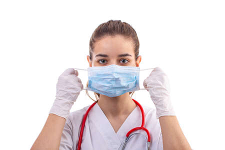Young woman medical professional nurse or doctor dressed with white hospital clothes