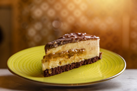 Slice of caramel and chocolate cheesecake on plate