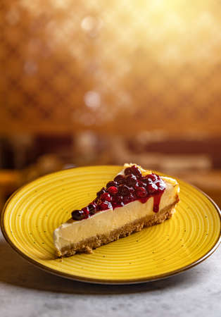 Simple mascarpone cheesecake with winter berry forest fruits, serving slicesの写真素材
