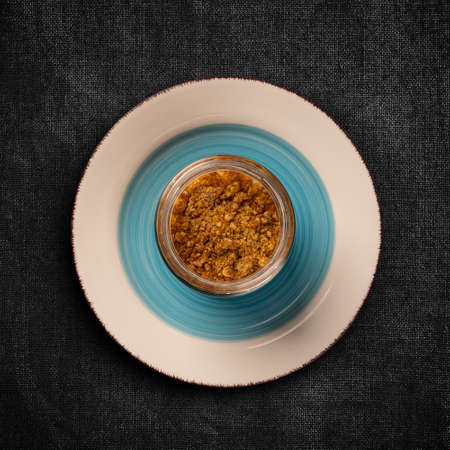 Flat lay of mousse with crumbs topping served in glassの写真素材
