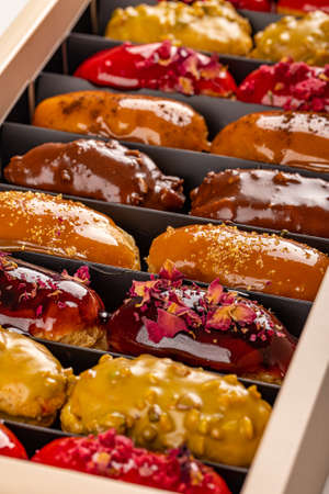 Set of eclairs. Amazing fresh colorful eclairs with icing