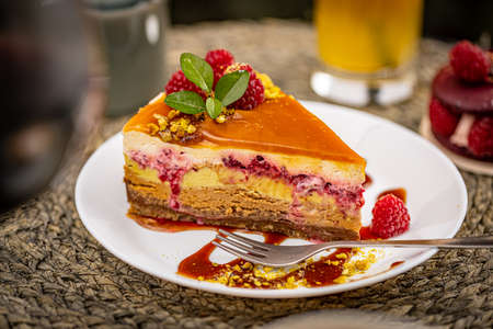 Piece of layered cake with fruit and caramel fudge