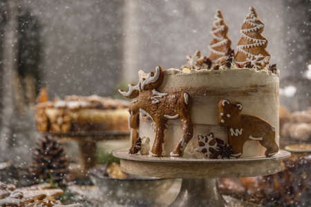 Still life of Christmas festive table with gingerbread cakeの写真素材