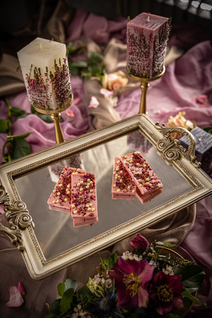 Homemade chocolate bars with lyophilized fruit and white chocolate pearls