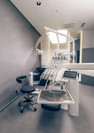 Modern dental clinic, dentist chair and other accessories used by dentistsの写真素材