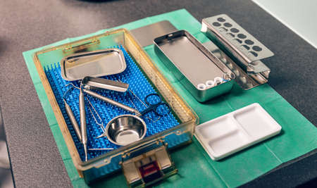 Dentist tools in a box on the table. Different medical dental devicesの写真素材