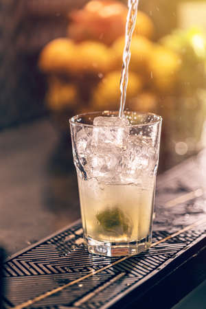 Bartender making a mojito cocktail