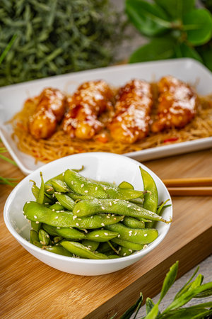Famous Chinese cuisine dishes on table. Green pea pods