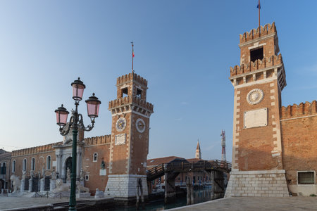 Venice. Old stone towers of the arsenal over the canalの写真素材