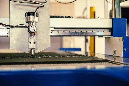 CNC water jet cutting machine modern industrial technology.の写真素材