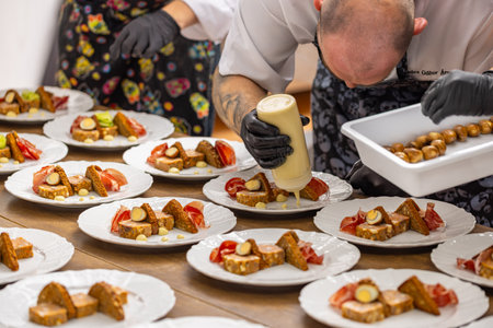 Scene encapsulates the art of culinary presentation in a professional kitchen setting.の写真素材