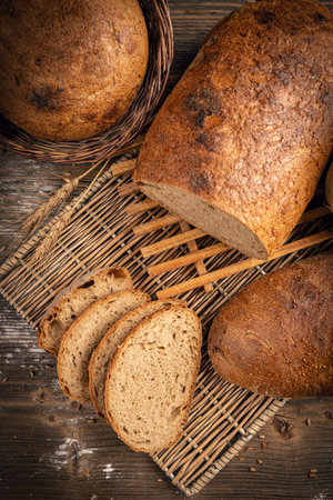 Artisan whole and sliced sourdough rye bread, top viewの写真素材