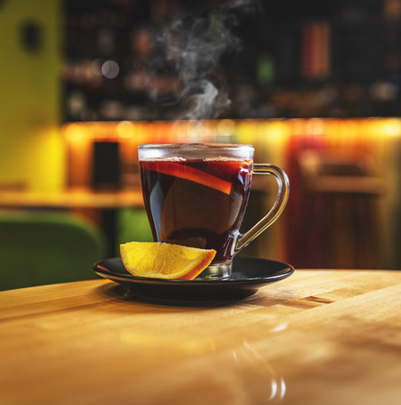 Traditional drink on autumn holiday, mulled wine with orange sliceの写真素材