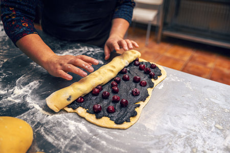 Rolling filling dough for make babka. Bakery procedureの写真素材
