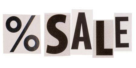 The word sale made from cut out letters from printed magazines, isolated on white background