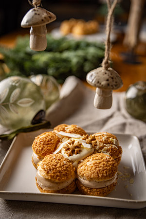 Delicious cream puffs forming flower shape on festive Christmas table