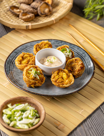 Breaded shiitake mushroom balls with dipping sauce, Chinese restaurant menu conceptの写真素材