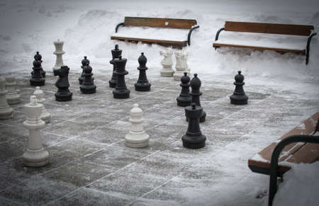 outdoor chess in snowy winterの写真素材