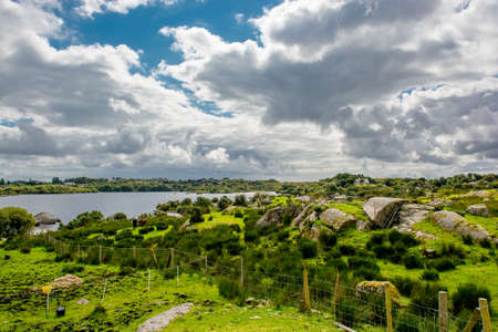 Pasture near Lake in Connemara in Irelandの写真素材