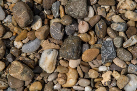 Colorful wet round pebbles