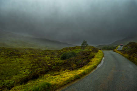 Scenic Single Track Road Through Hills On Isle Of Skye In Scotlandの写真素材