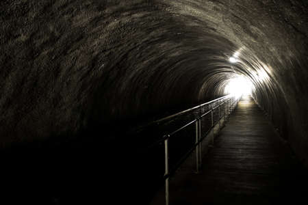 Bright Light At The End Of A Dark And Creepy Tunnelの写真素材
