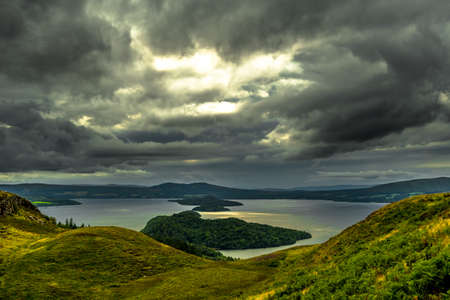 Calm Water And Green Meadows At Loch Lomond In Scotland