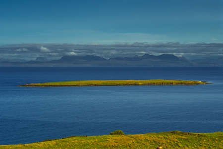Remote Island With Flock Of Sheep At The Coast Of The Isle Of Skye In Scotlandの写真素材