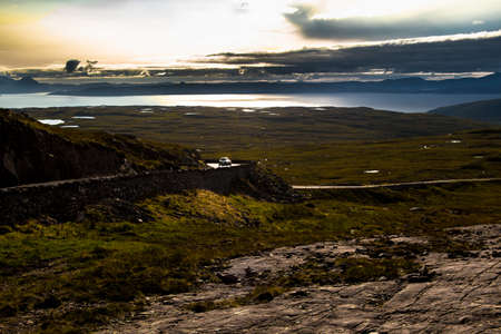View From Applecross Pass To Scenic Landscape With Curvy Single Track Road And The Isle Of Skye In...