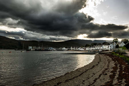 City Of Ullapool With Harbor And Boats Facing Heavy Weather At Loch Broom In Scotland