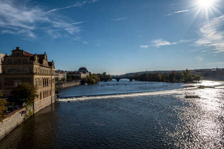 Bridge Over Moldova River And Historic Buildings In Prague In The Czech Republicの写真素材