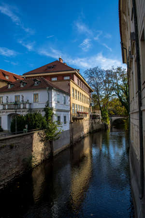 Old Building And Bridge Over Small River In Prague In The Czech Republicの写真素材