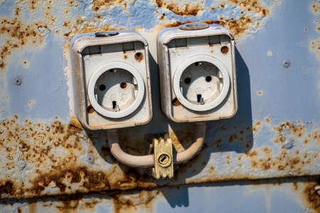 Two Old Rusty Electric Wall Socketsの写真素材