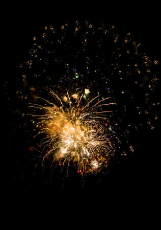 Celebration With Bright Colorful Fireworks Over Black Skyの写真素材